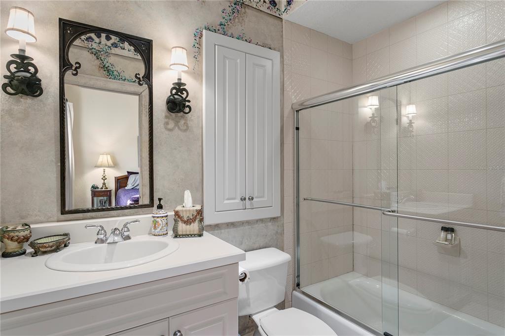 4803 West Woodmere Road Tampa, FL 33609 - Photo 52 of 80 a bathroom with a bathtub shower sink vanity and toilet