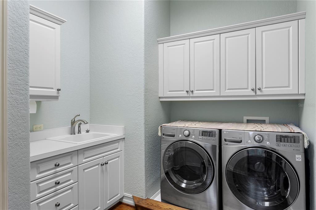 4803 West Woodmere Road Tampa, FL 33609 - Photo 53 of 80 a utility room with sink dryer and washer