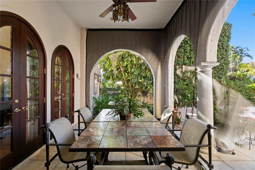 4803 West Woodmere Road Tampa, FL 33609 - Photo 56 of 80 a view of a dining room with furniture and chandelier