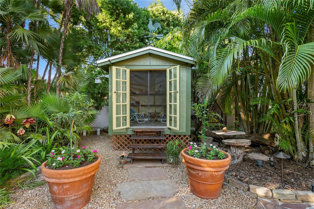 4803 West Woodmere Road Tampa, FL 33609 - Photo 60 of 80 a front view of a house with a garden