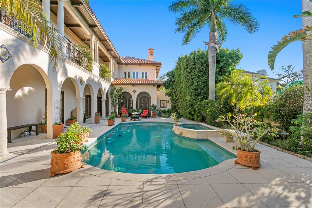 4803 West Woodmere Road Tampa, FL 33609 - Photo 68 of 80 a view of a house with swimming pool and sitting area