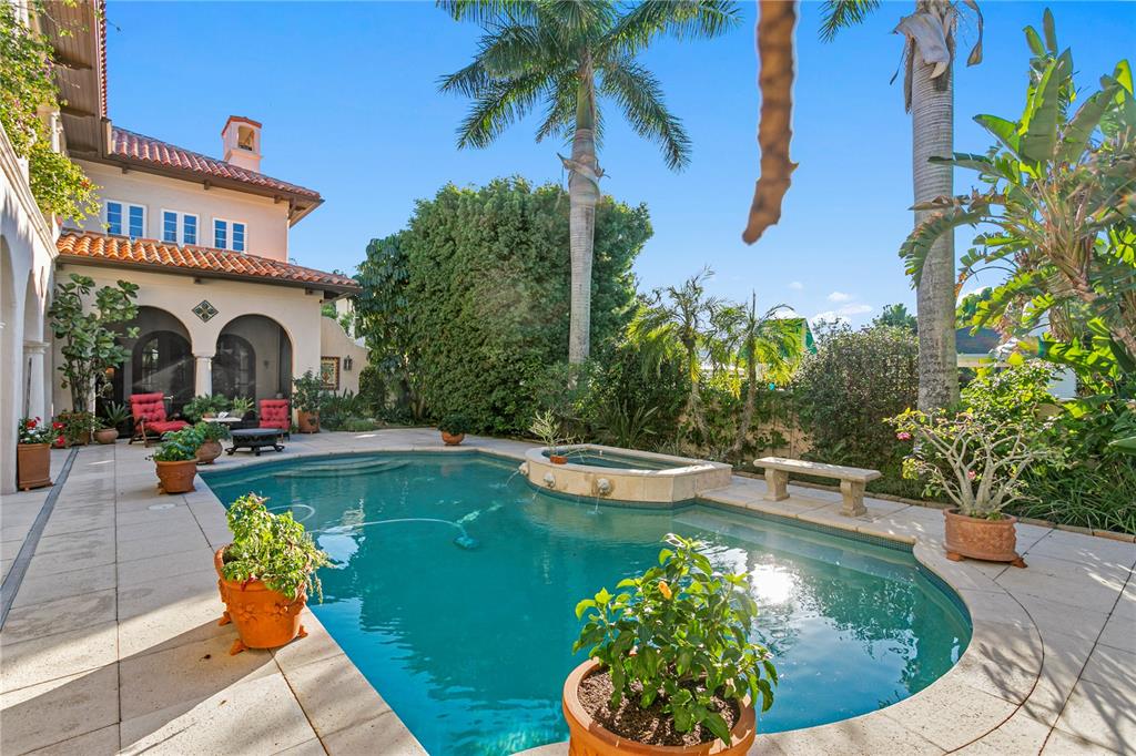 4803 West Woodmere Road Tampa, FL 33609 - Photo 70 of 80 a view of a house with swimming pool and sitting area