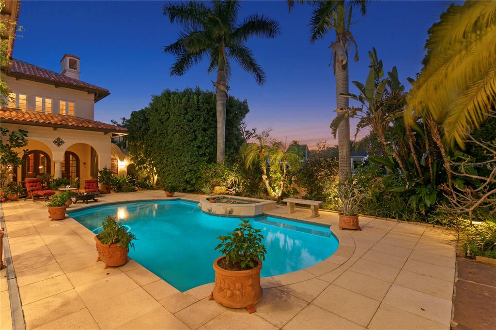 4803 West Woodmere Road Tampa, FL 33609 - Photo 79 of 80 a view of a swimming pool with a patio