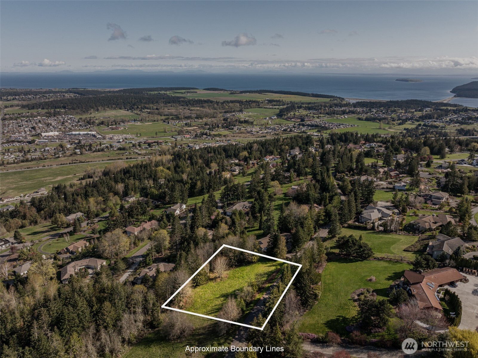 999 Ravens Ridge Road Sequim, WA 98382 - Photo 3 of 40 an aerial view of multiple house