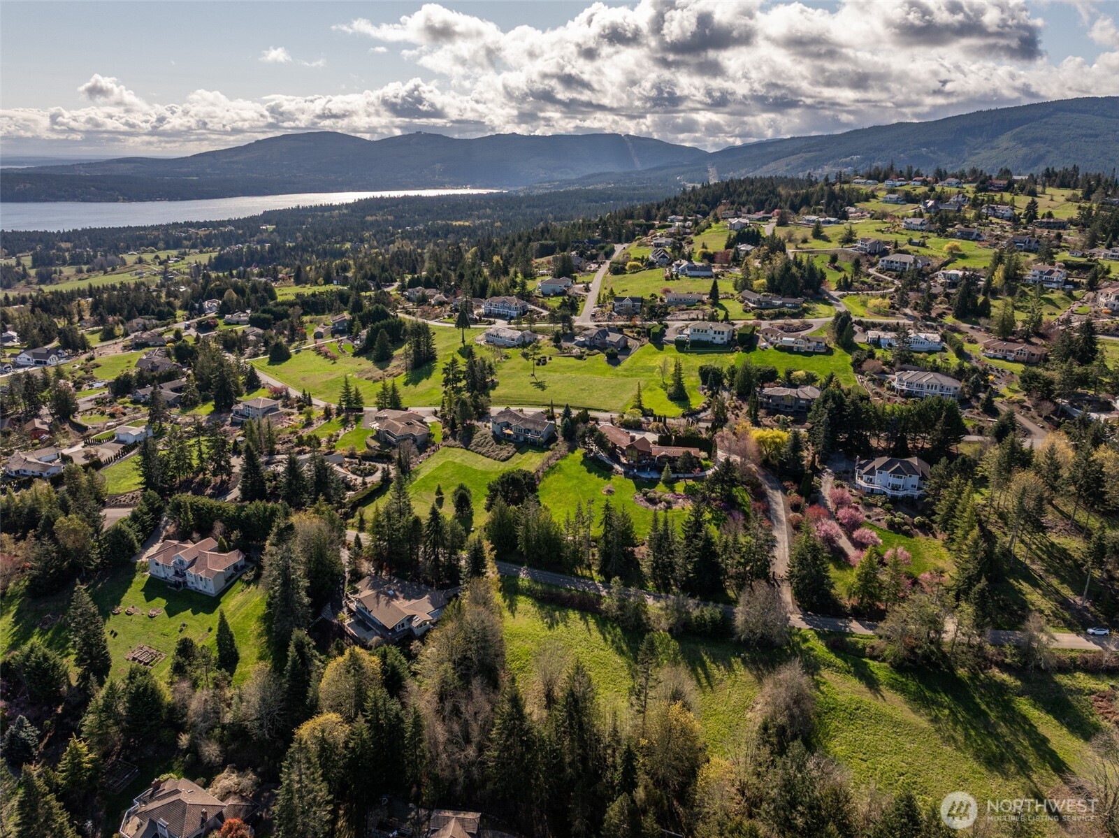 999 Ravens Ridge Road Sequim, WA 98382 - Photo 39 of 40 a view of a lake with houses