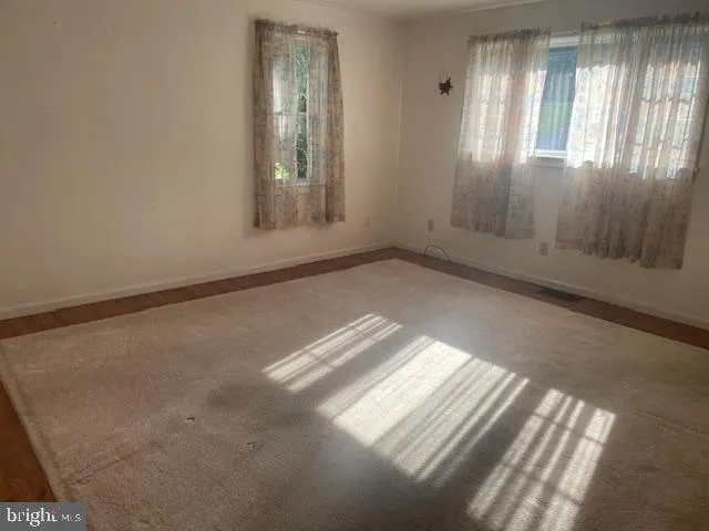 a view of an empty room and window