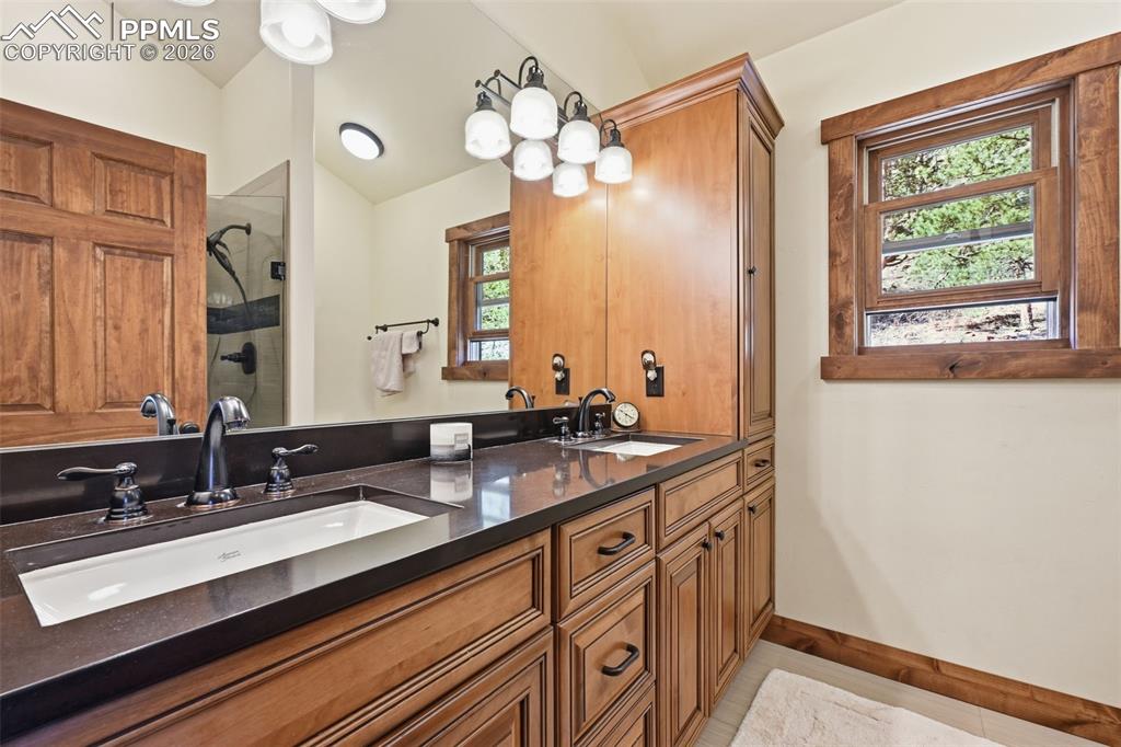 89 Ranch View Road Florissant, CO 80816 - Photo 29 of 50 The primary retreat offers dual sinks and tons of storage and countertop space.