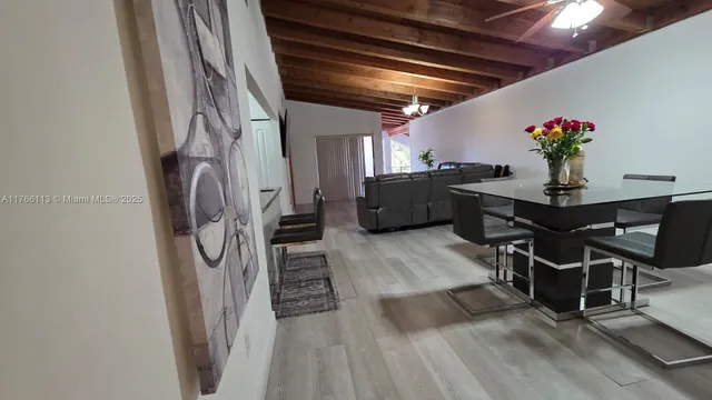 a room with furniture and a flat screen