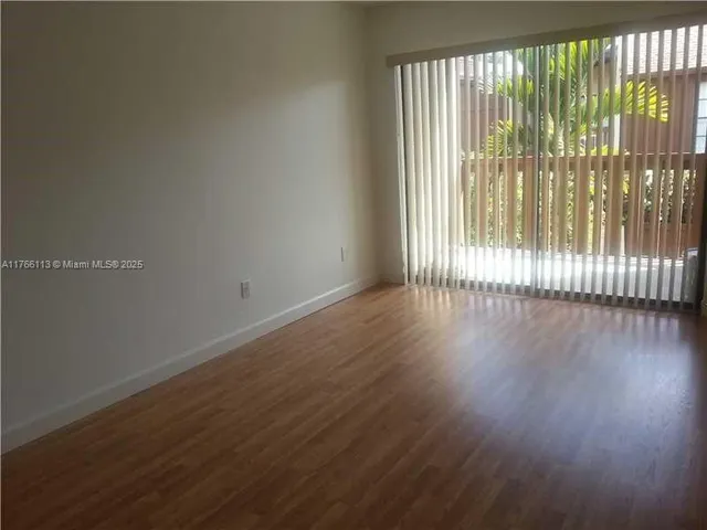 a view of backyard with potted plants