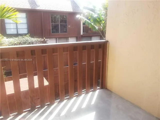 a view of a street with a cars parked
