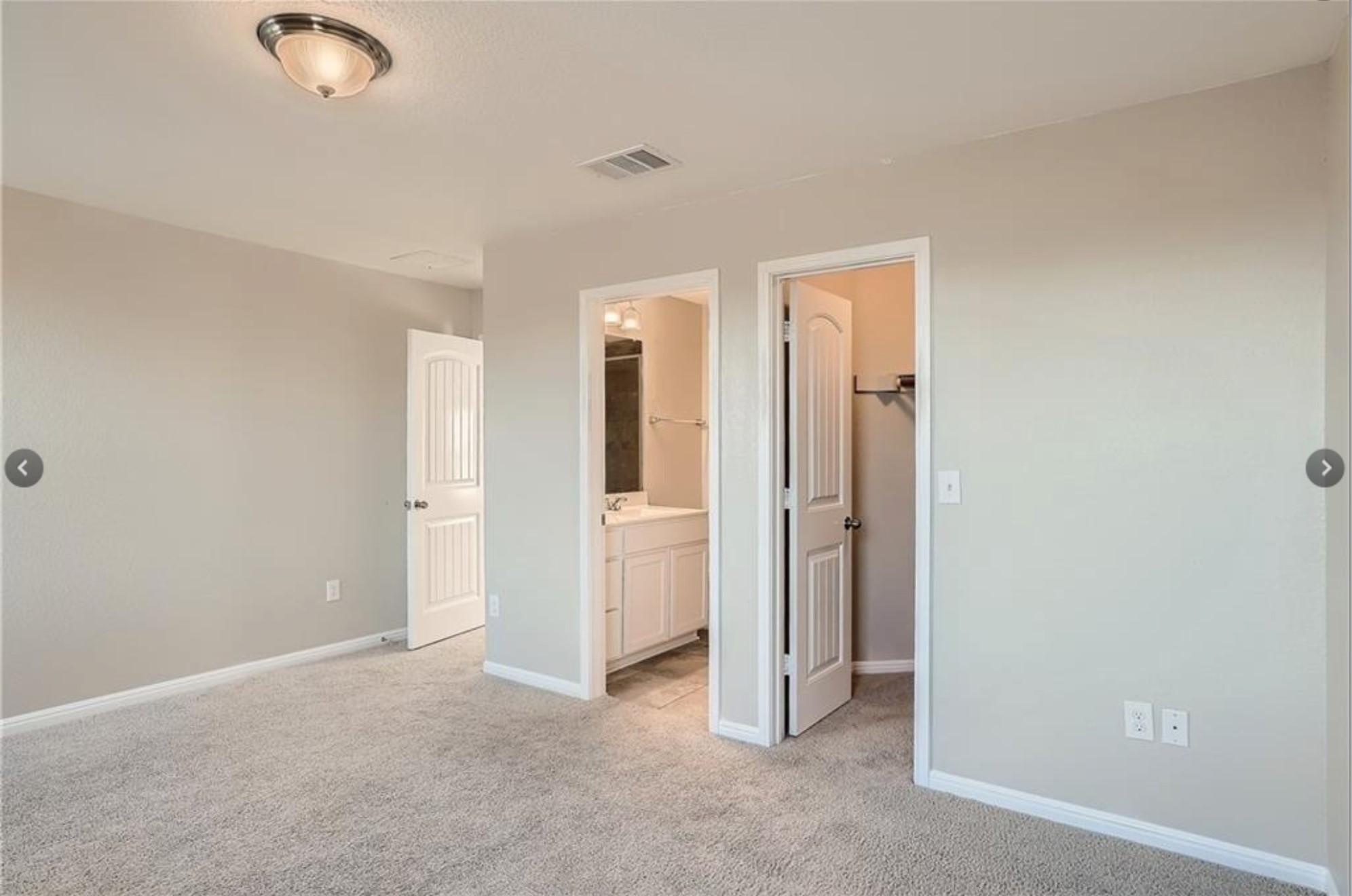 304 Cane River Road Pflugerville, TX 78660 - Photo 18 of 31 A well-lit bedroom with fresh carpeting provides a neutral canvas for personalization.