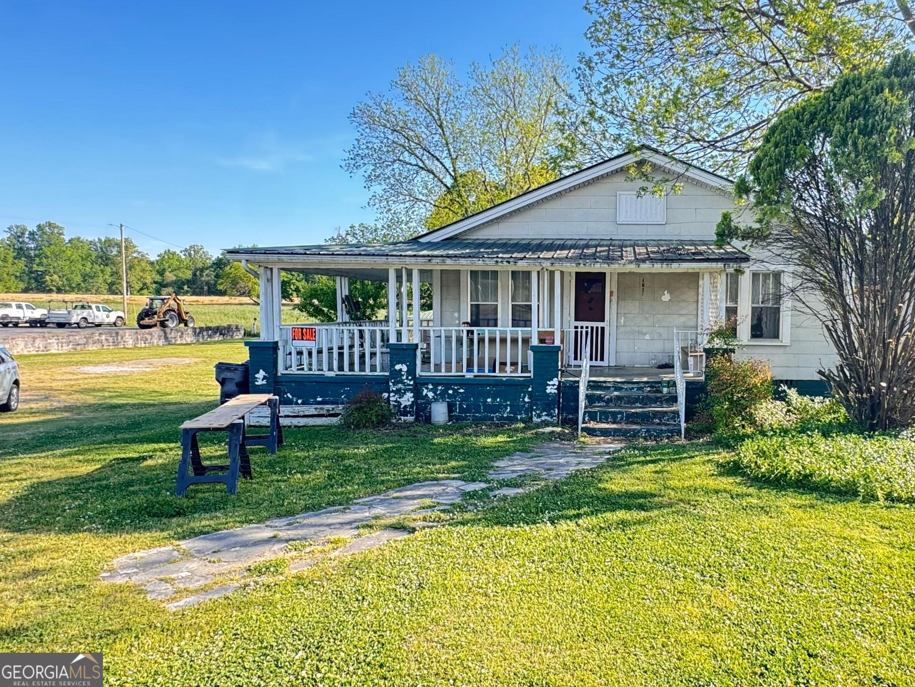 1199 West Main Street Centre, AL 35960 - Photo 1 of 11 a view of a house with backyard porch and garden