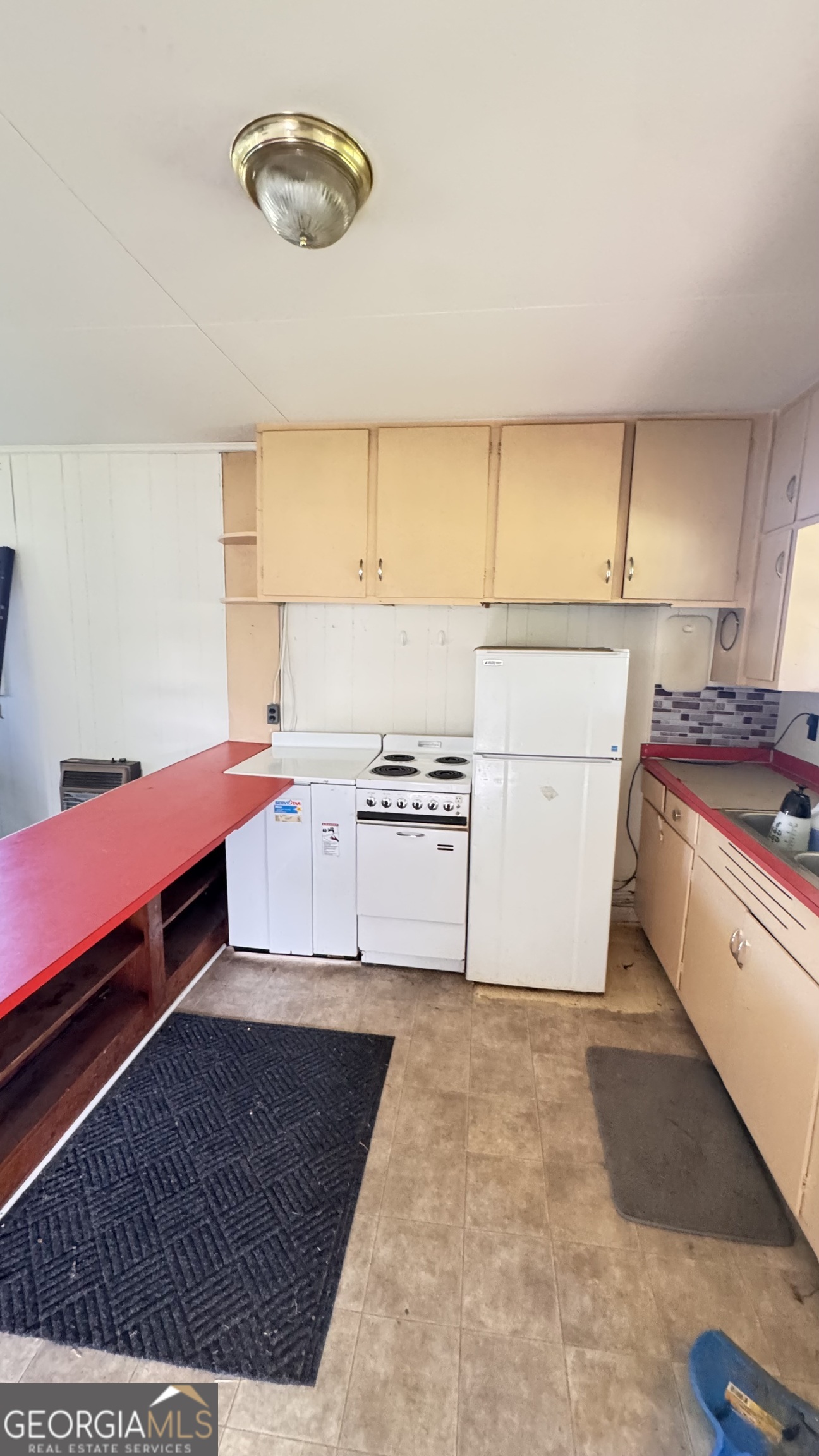 1199 West Main Street Centre, AL 35960 - Photo 10 of 11 a kitchen with a cabinets and white appliances