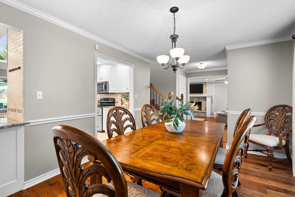 410 Simmons Road Double Oak, TX 75077 - Photo 11 of 40 Elegant formal dining room with room for a dining table that seats 10.