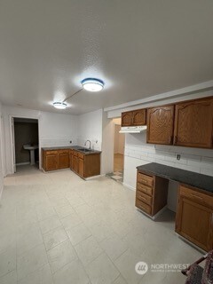 1414 East Fir Street Seattle, WA 98122 - Photo 14 of 30 a kitchen with stainless steel appliances a sink and a stove