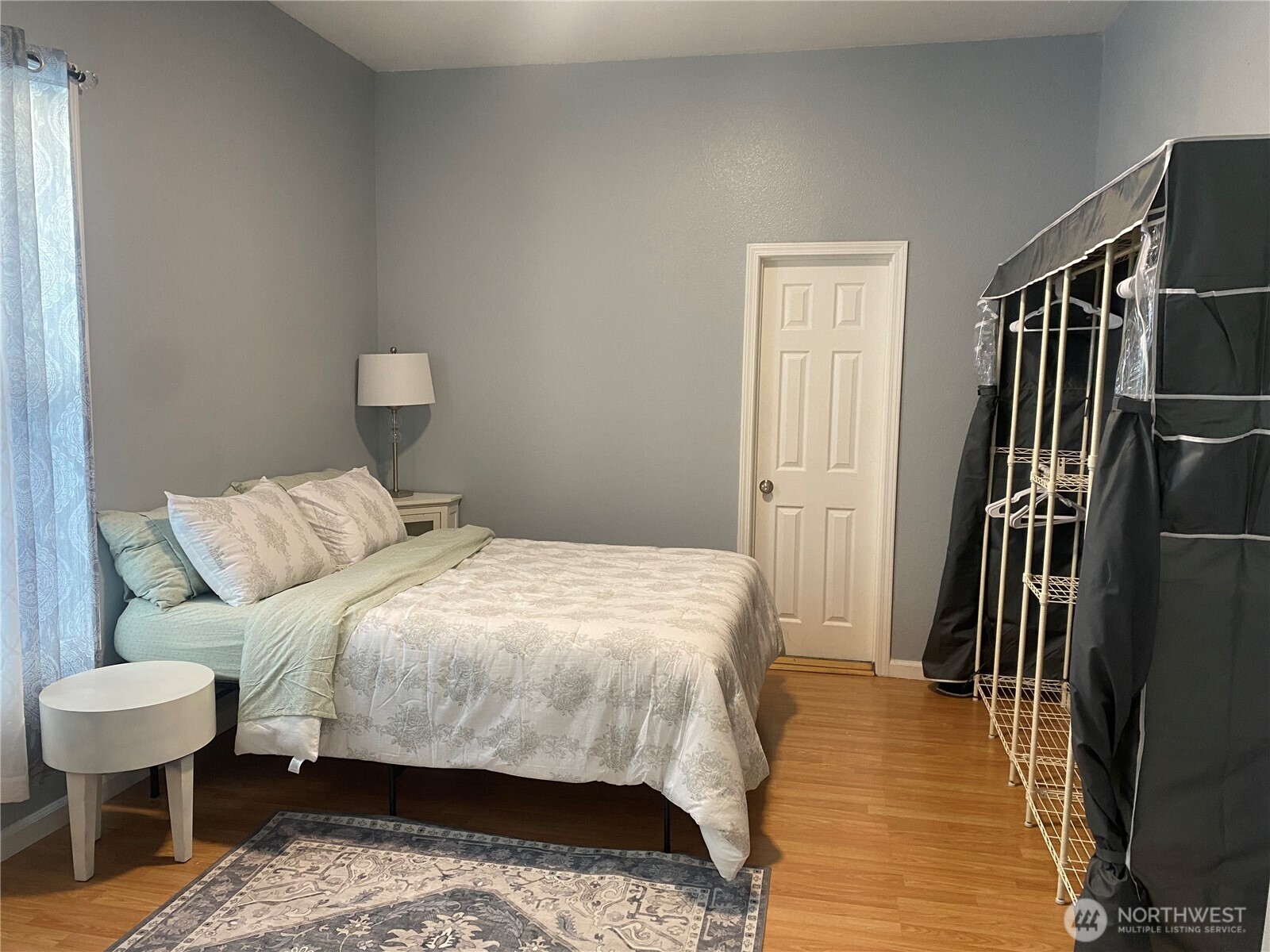 1414 East Fir Street Seattle, WA 98122 - Photo 30 of 30 a bedroom with a bed and wooden floor