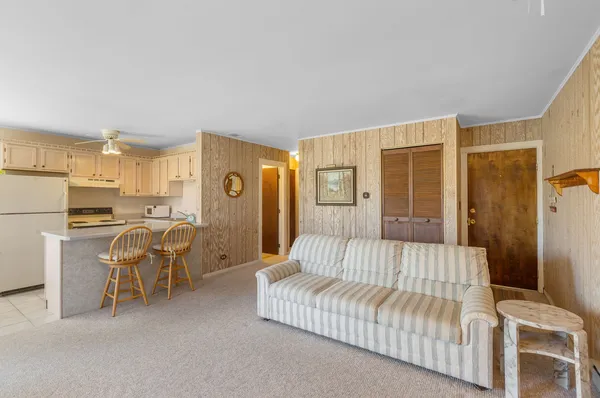 a bedroom with furniture and a rug