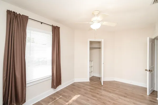 a view of a house with a yard porch and sitting area