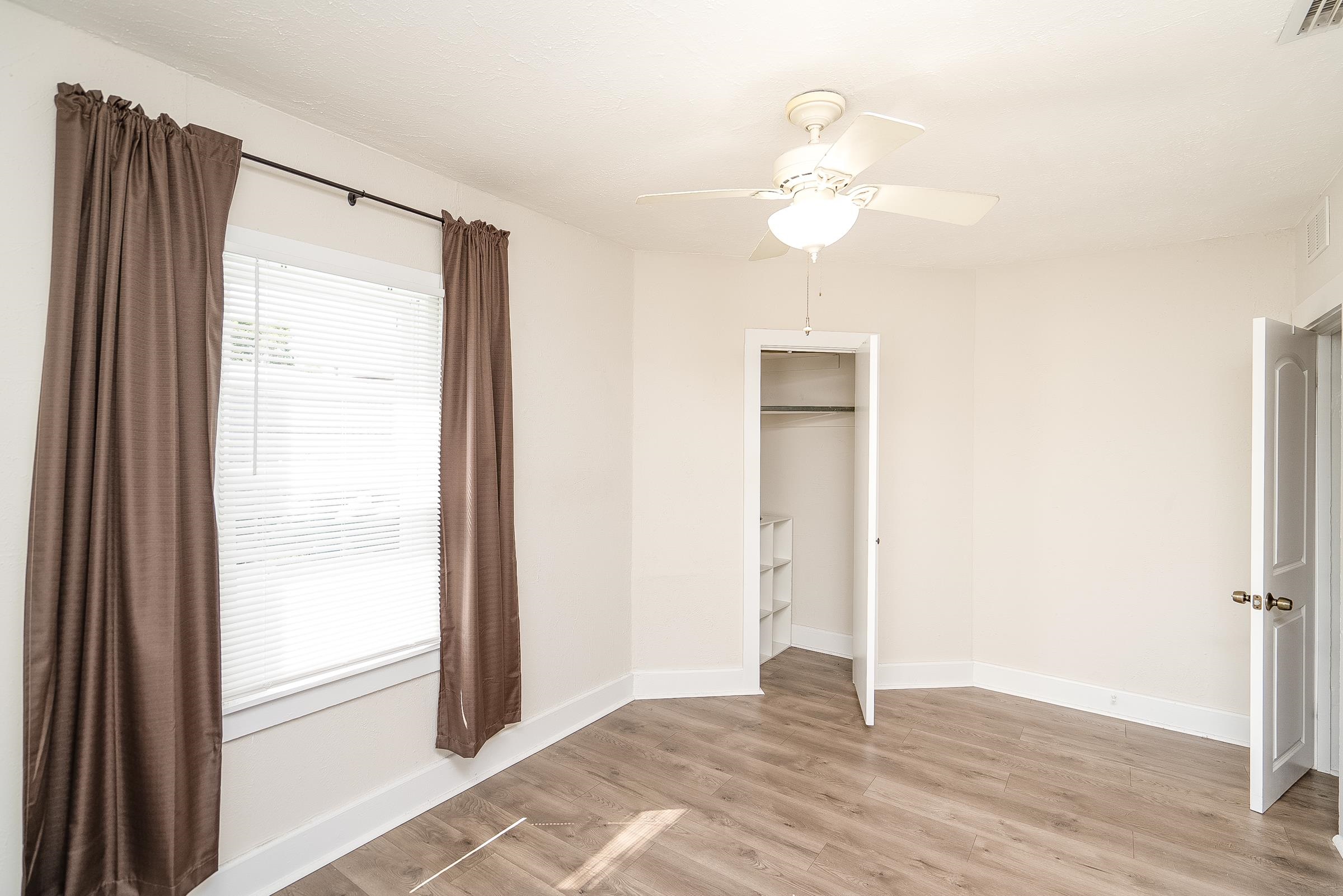 32 Grant Street St. Augustine, FL 32084 - Photo 22 of 24 a view of an empty room with wooden floor and a window