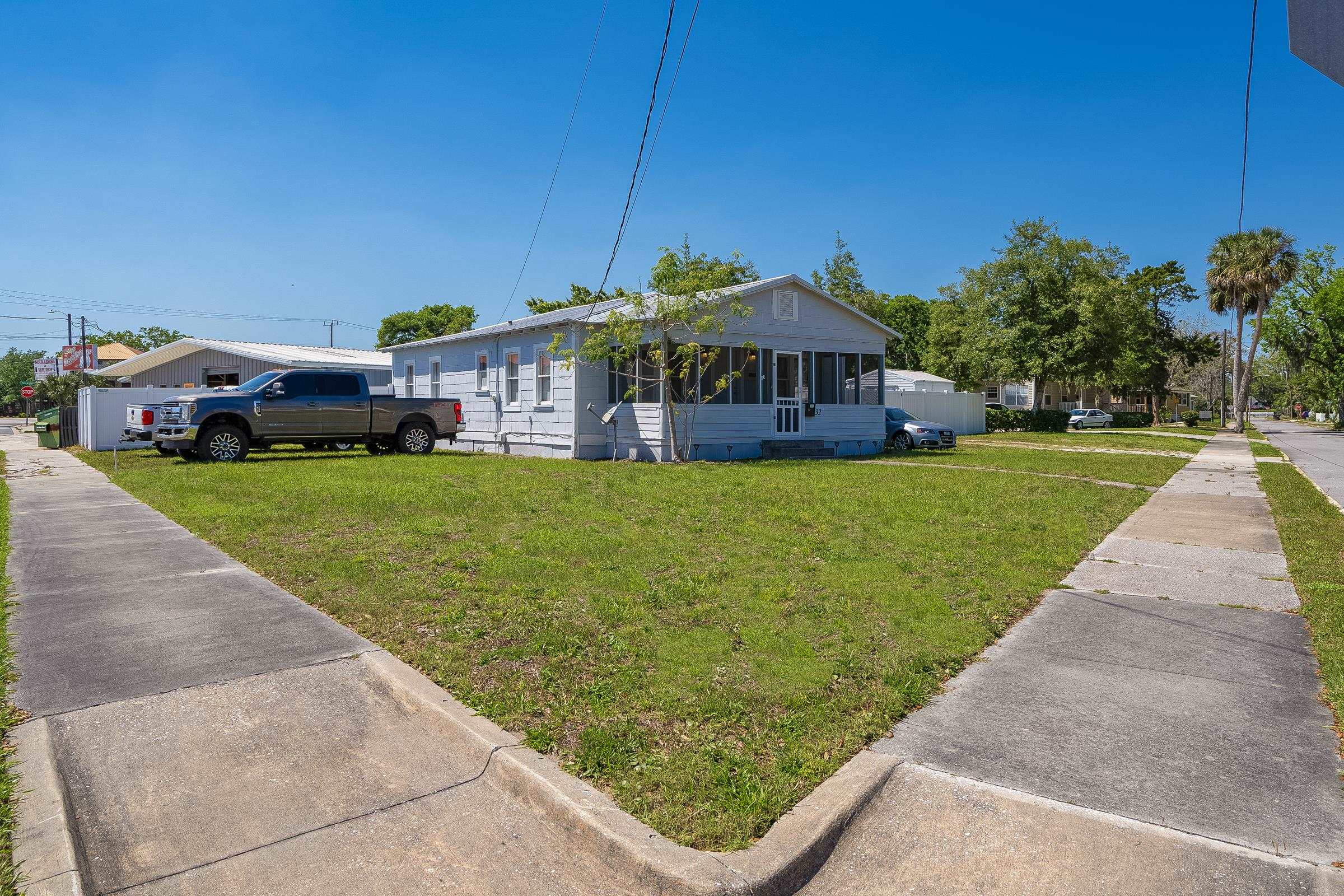 32 Grant Street St. Augustine, FL 32084 - Photo 23 of 24 a view of a house with a yard porch and sitting area