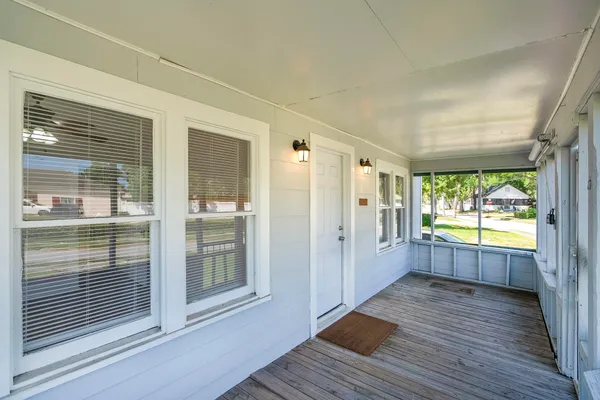 a view of a big room with wooden floor and outdoor space