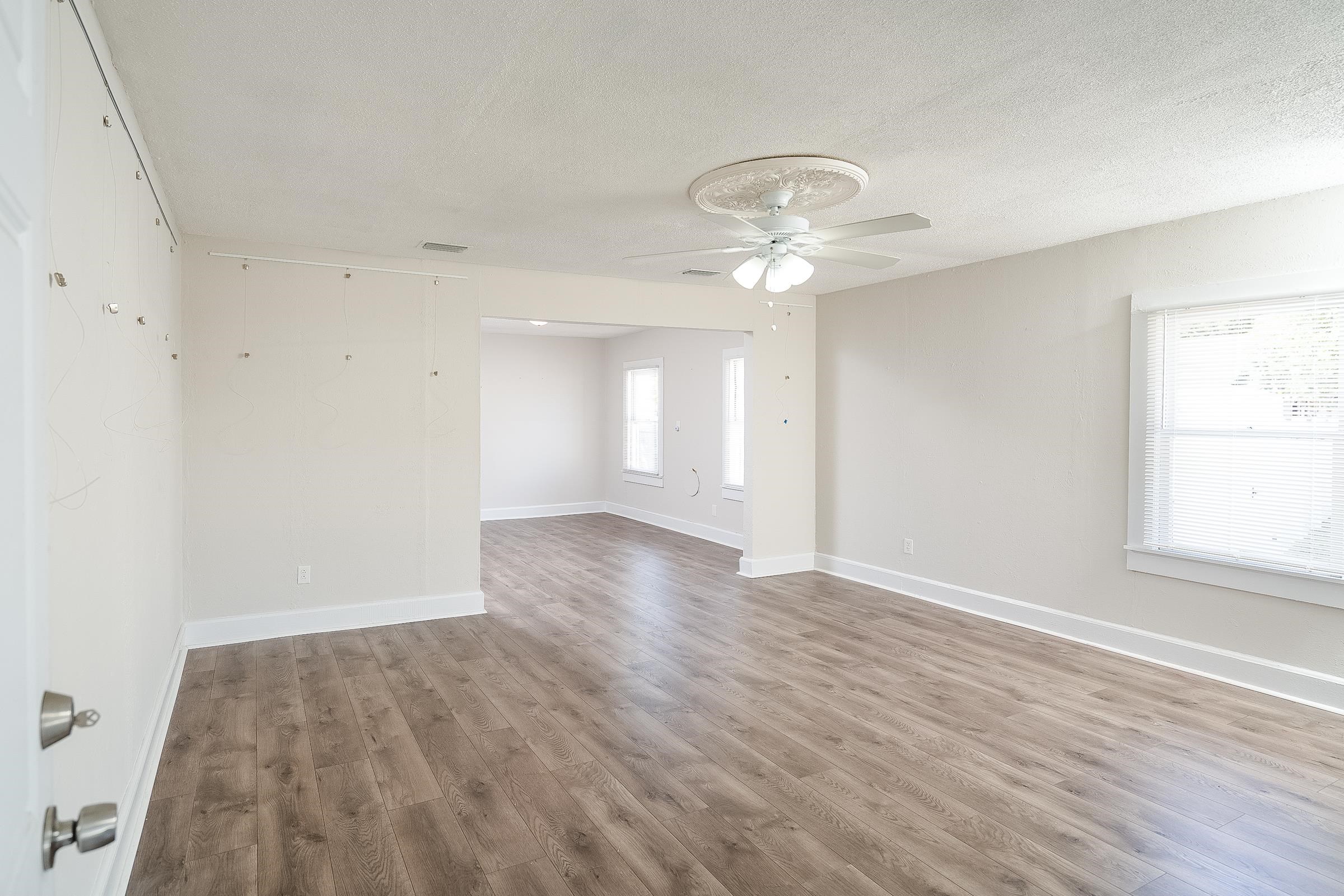 32 Grant Street St. Augustine, FL 32084 - Photo 8 of 24 an empty room with wooden floor and windows