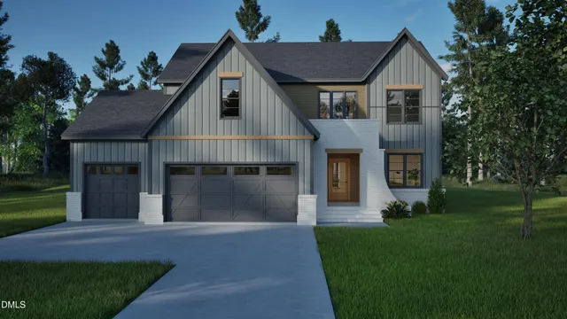 a front view of a house with a garden and yard