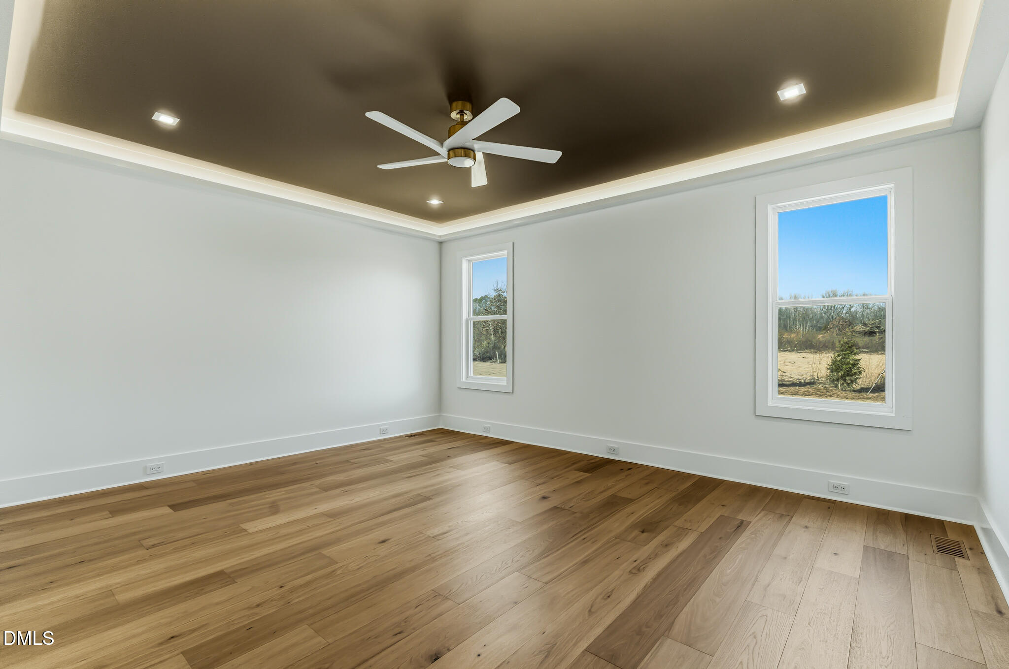 45 Harvest View Way Franklinton, NC 27525 - Photo 29 of 64 a view of an empty room with wooden floor and a window