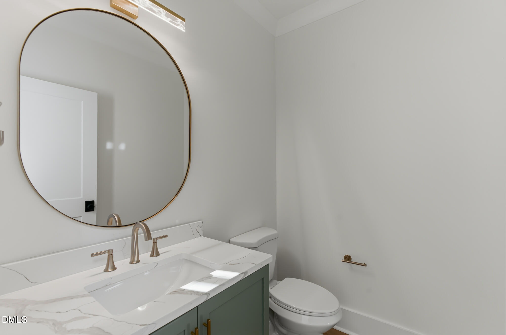 45 Harvest View Way Franklinton, NC 27525 - Photo 38 of 64 a bathroom with a sink a mirror and a toilet