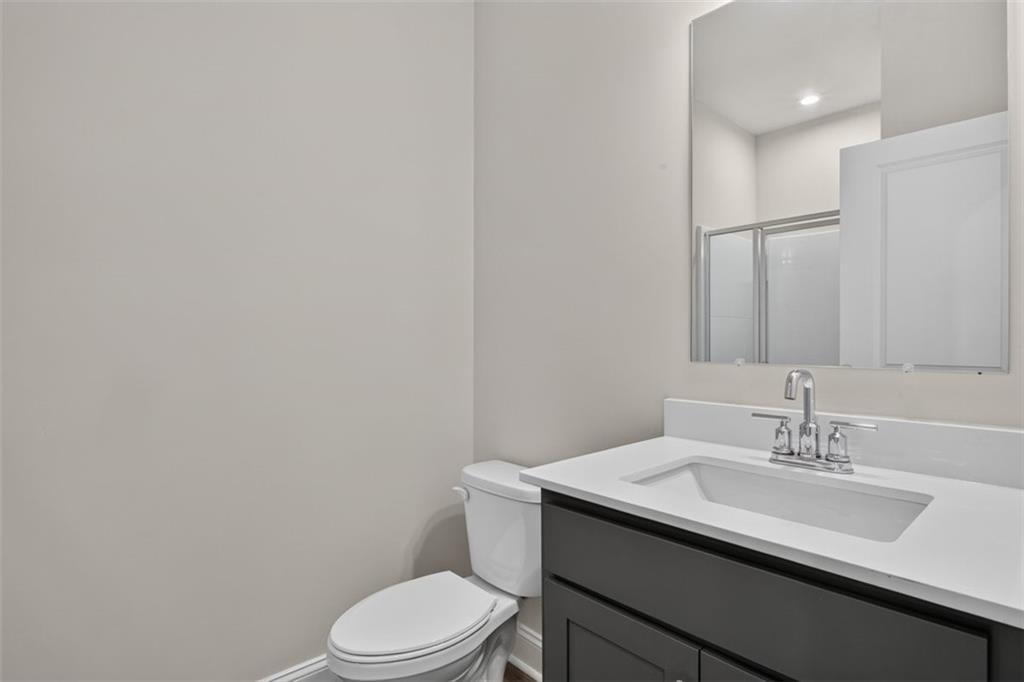 107 Ledgemont Way Acworth, GA 30101 - Photo 20 of 57 a bathroom with a granite countertop sink toilet and mirror