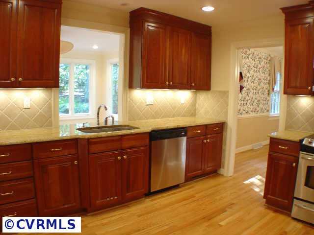 14211 Newgate Road Midlothian, VA 23113 - Photo 4 of 10 a kitchen with stainless steel appliances granite countertop wooden cabinets a sink and dishwasher