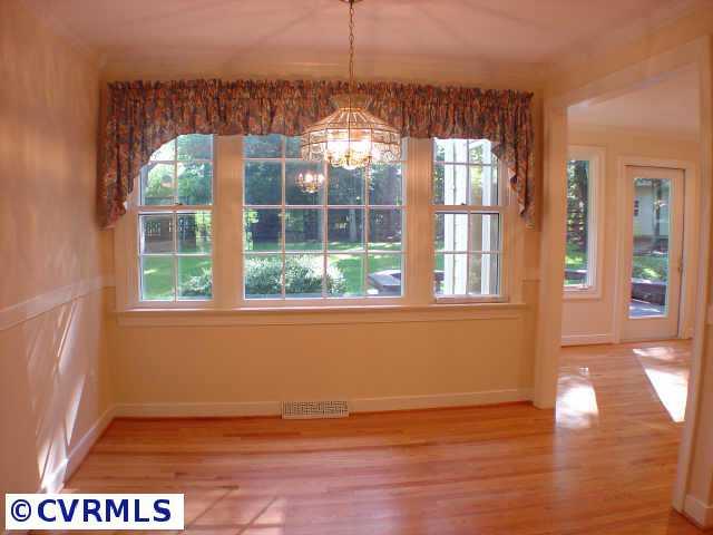 14211 Newgate Road Midlothian, VA 23113 - Photo 5 of 10 a view of empty room with wooden floor and fan