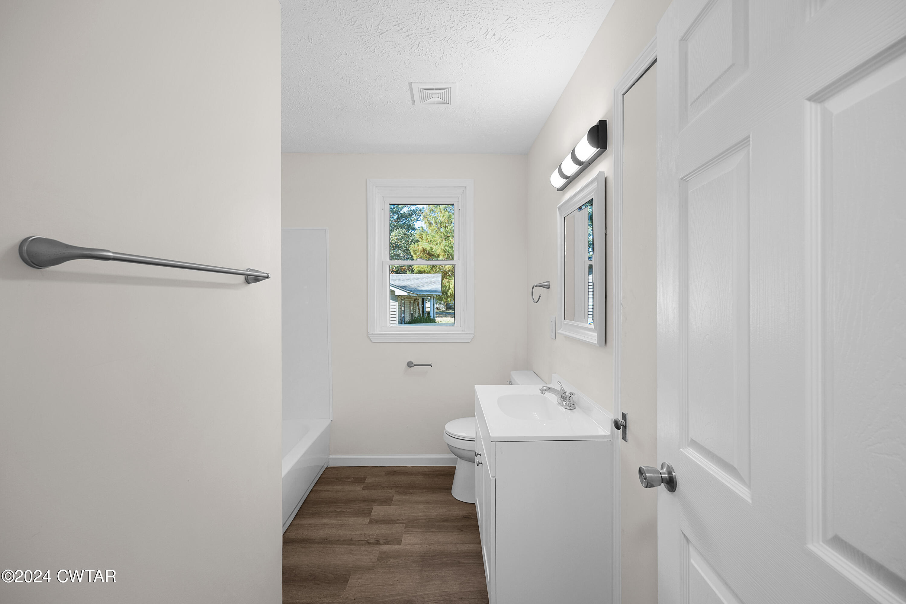 309 West Knox Street Rutherford, TN 38369 - Photo 11 of 16 a bathroom with a sink a toilet and shower
