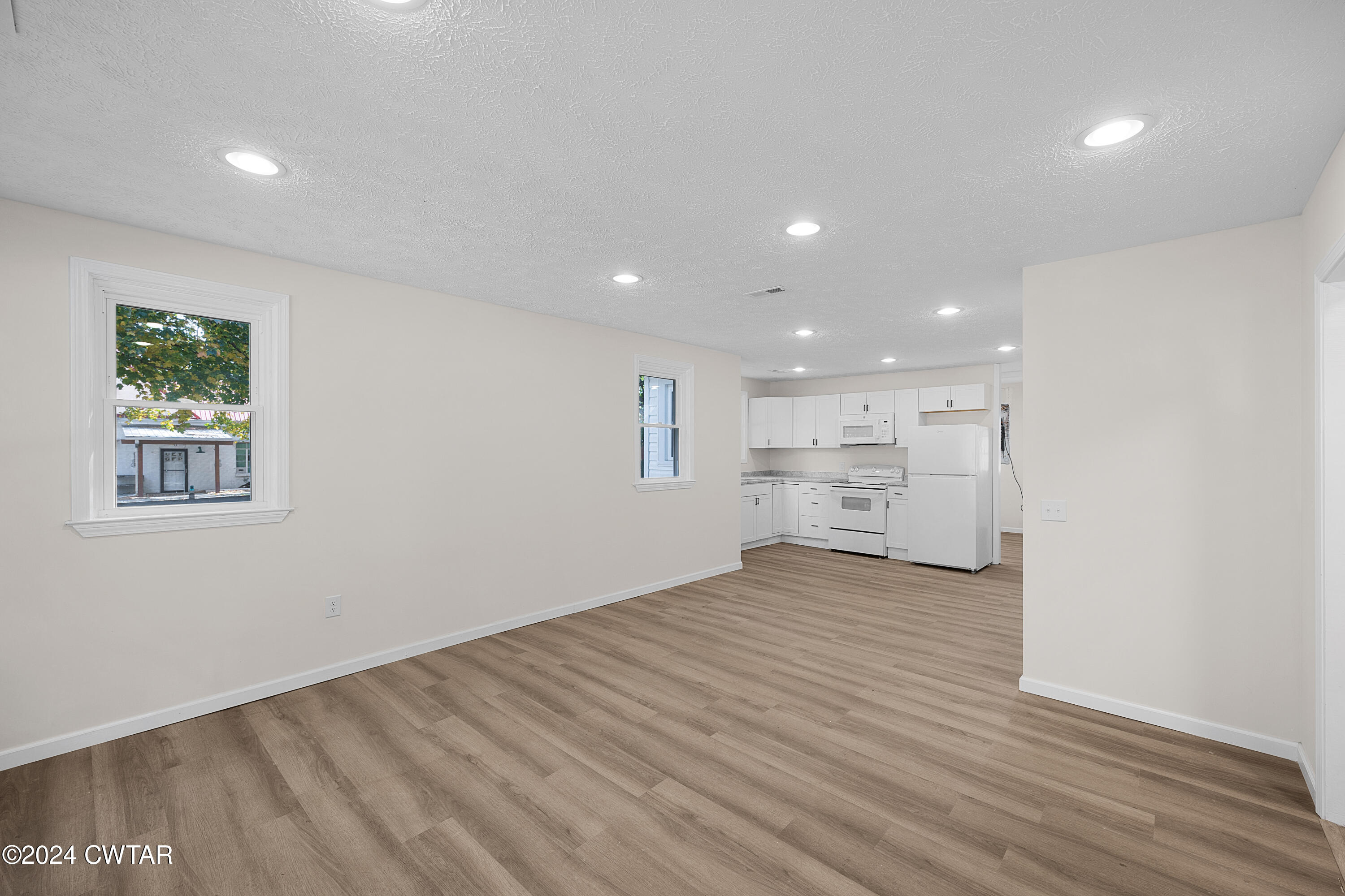309 West Knox Street Rutherford, TN 38369 - Photo 5 of 16 a view of a kitchen with wooden floor and windows
