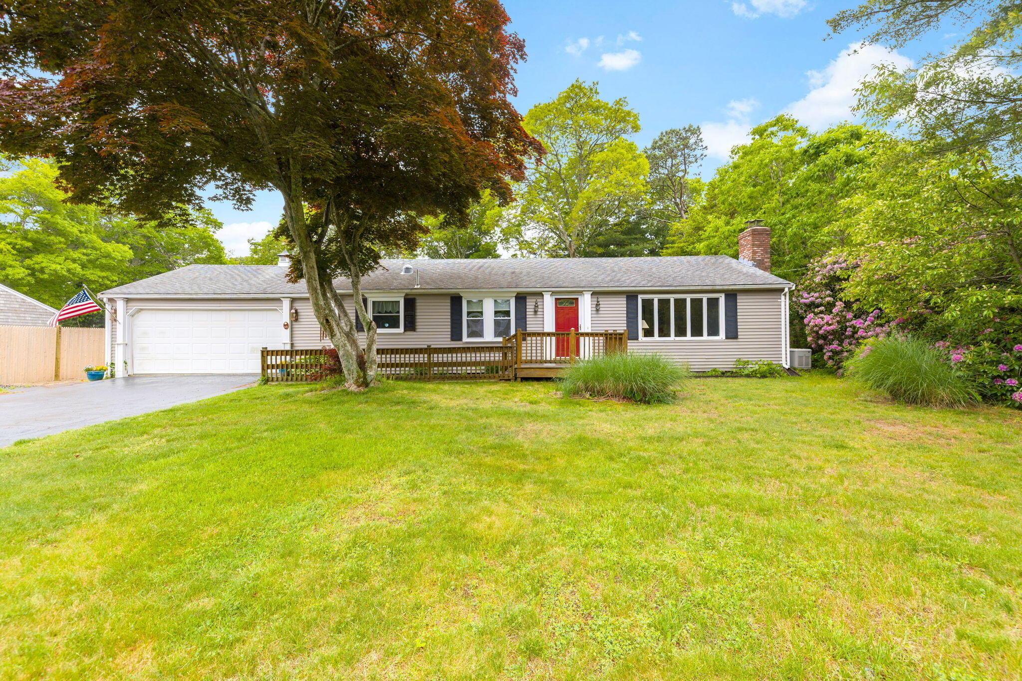 65 Thistle Drive Centerville, MA 02632 - Photo 1 of 28 a view of a house with pool and sitting area