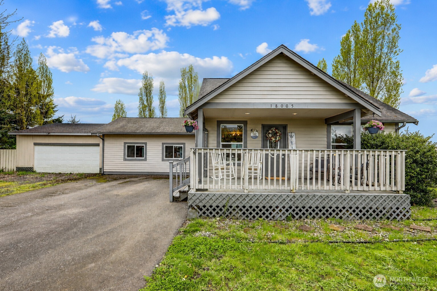 18005 Iris Place Southwest Rochester, WA 98579 - Photo 1 of 18 a front view of a house with a yard