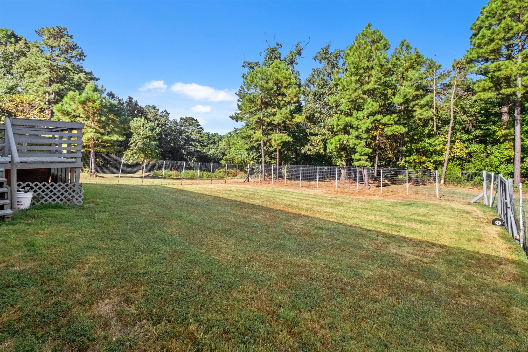 57443 667th Colcord, OK 74338 - Photo 31 of 51 Expansive grassy yard area with perimeter fencing and mature trees