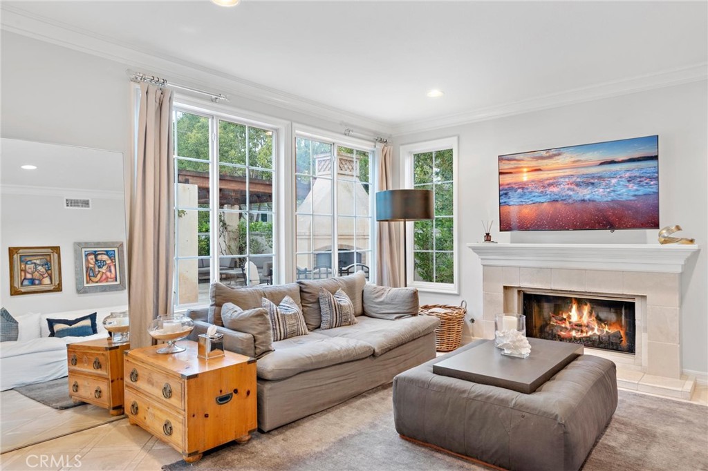 1 Meryton Irvine, CA 92603 - Photo 14 of 40 a living room with furniture large window and a fireplace