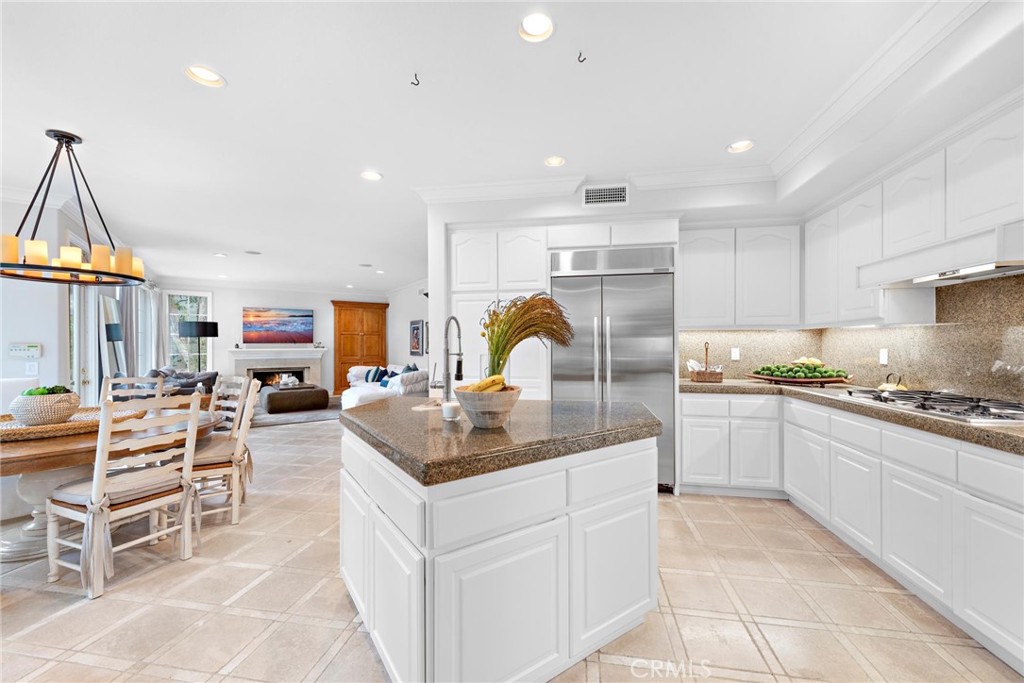 1 Meryton Irvine, CA 92603 - Photo 17 of 40 a kitchen with stainless steel appliances granite countertop a sink and cabinets