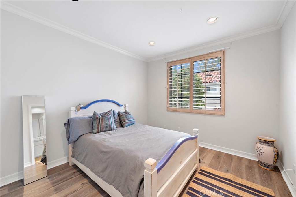 1 Meryton Irvine, CA 92603 - Photo 32 of 40 a bedroom with a large bed and a window