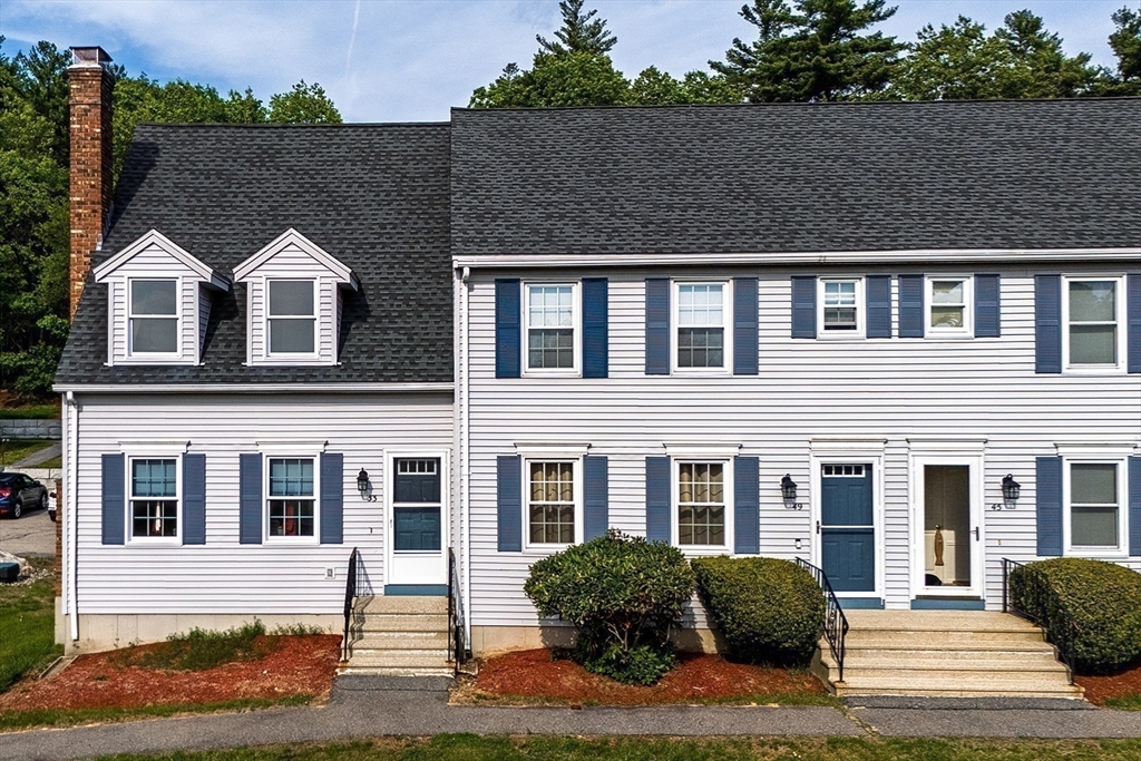 53 Century Way, Unit 53 Gardner, MA 01440 - Photo 1 of 22 a front view of a house with a yard