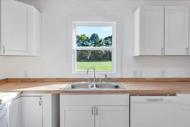 a kitchen with a sink and cabinets