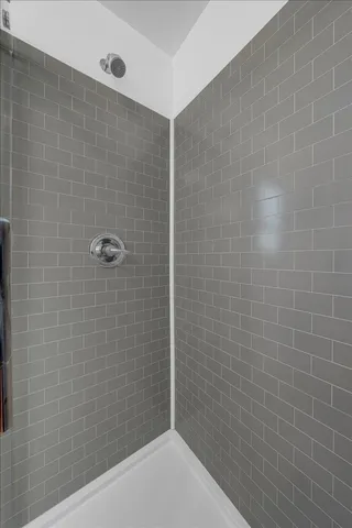a view of a room with wooden floor and window