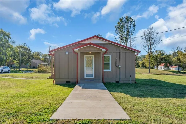 a front view of a house with a yard