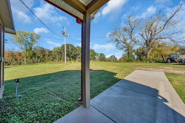 a view of a lake with a yard and mountain view