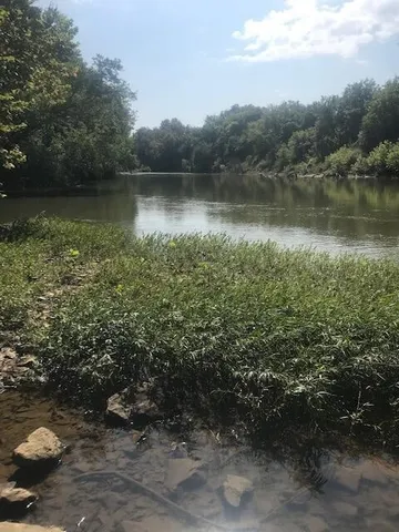 a view of an ocean and a yard