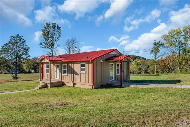 a view of a house with a big yard