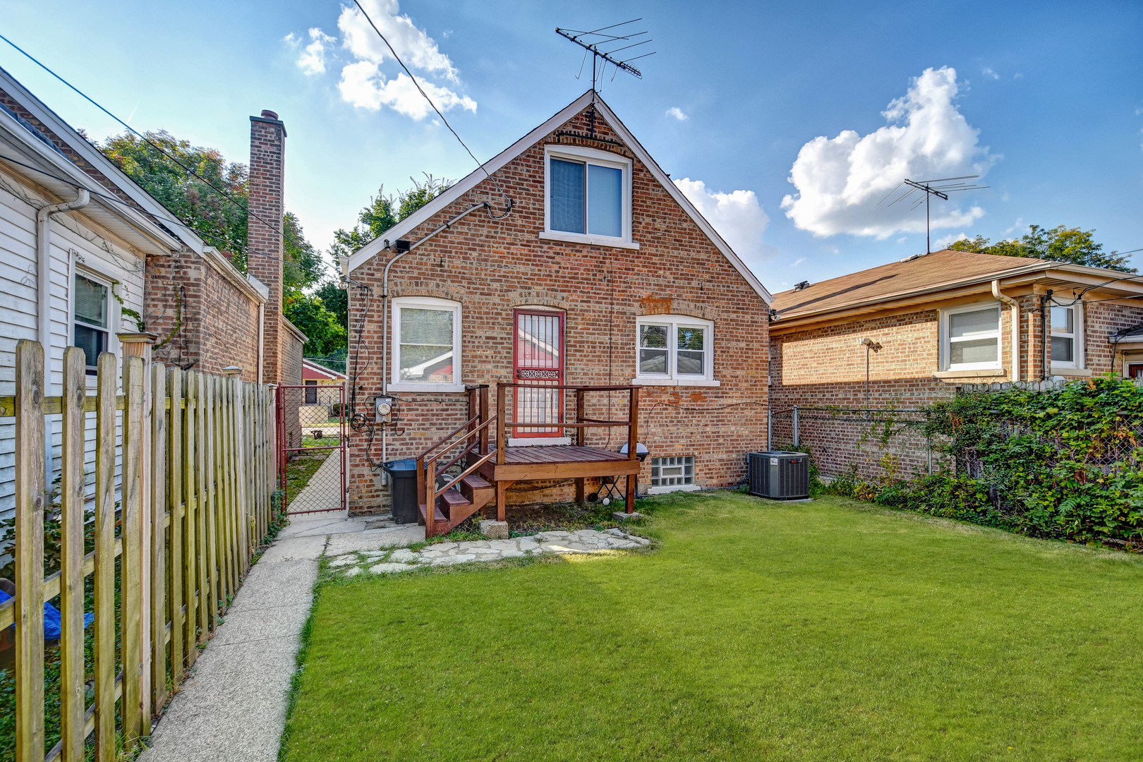 9041 South East End Avenue Chicago, IL 60617 - Photo 17 of 18 a view of a house with a yard