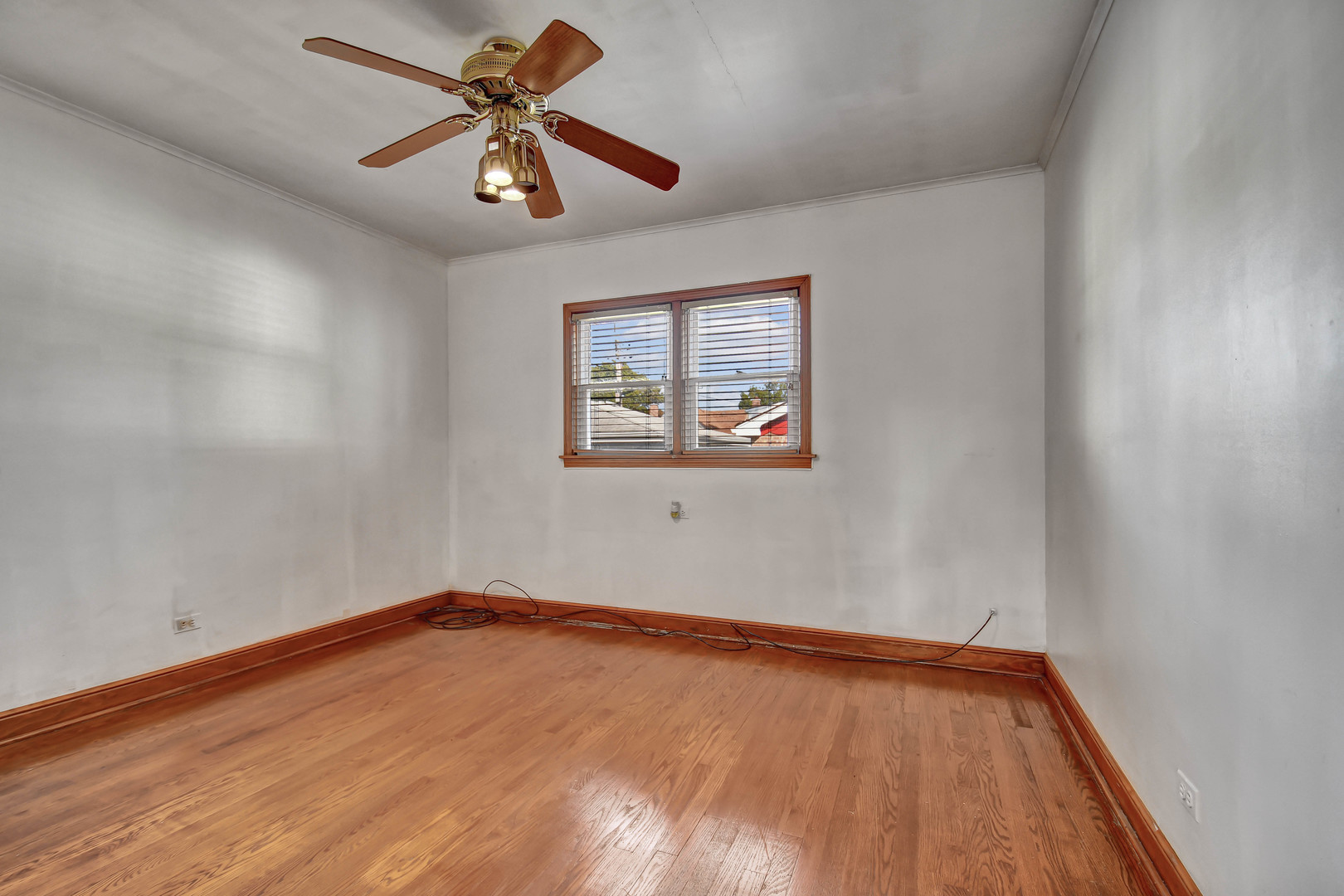 9041 South East End Avenue Chicago, IL 60617 - Photo 10 of 18 an empty room with a window and a ceiling fan