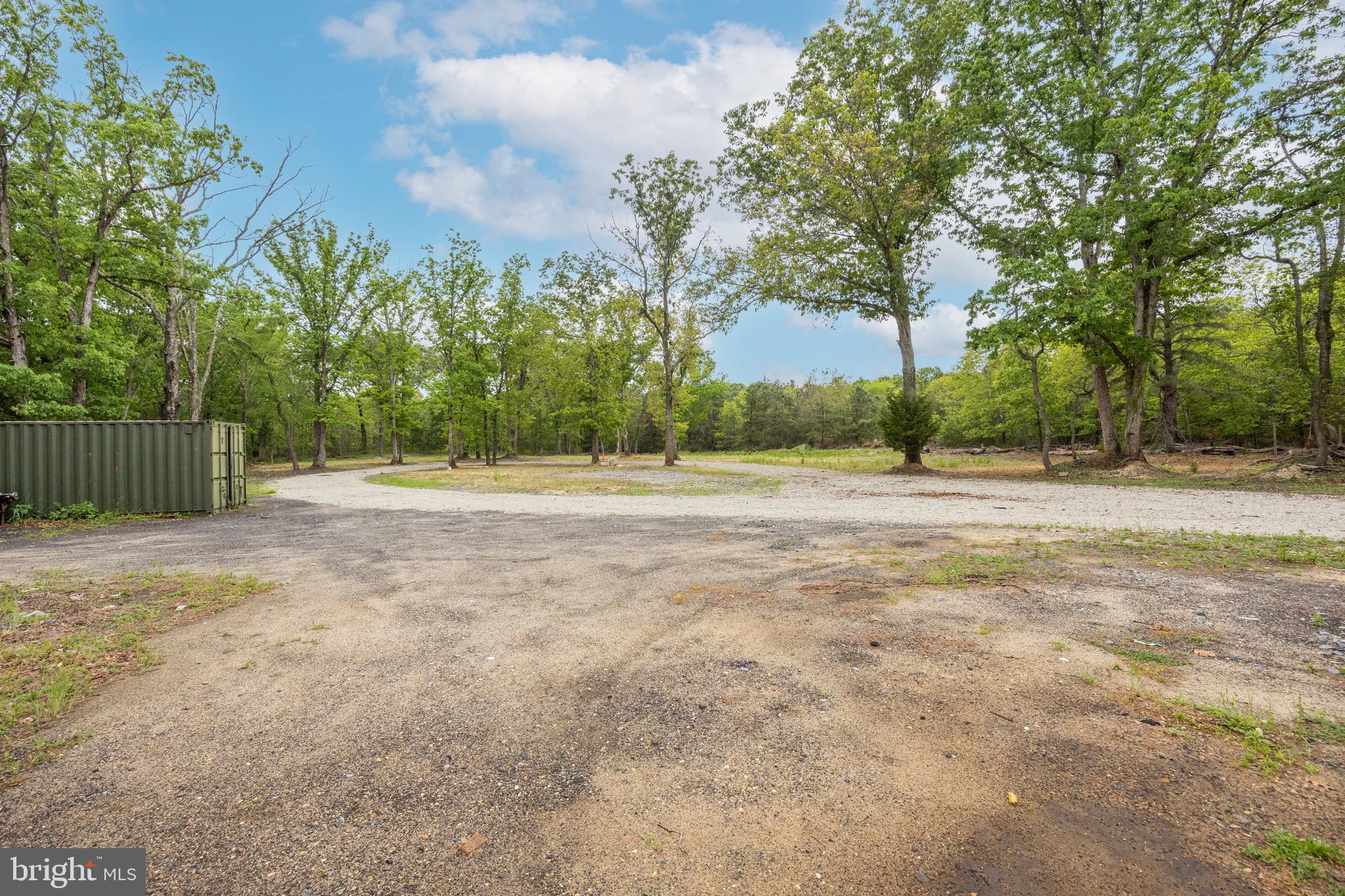 687 Jackson Road Atco, NJ 08004 - Photo 20 of 20 a backyard of a house with large trees